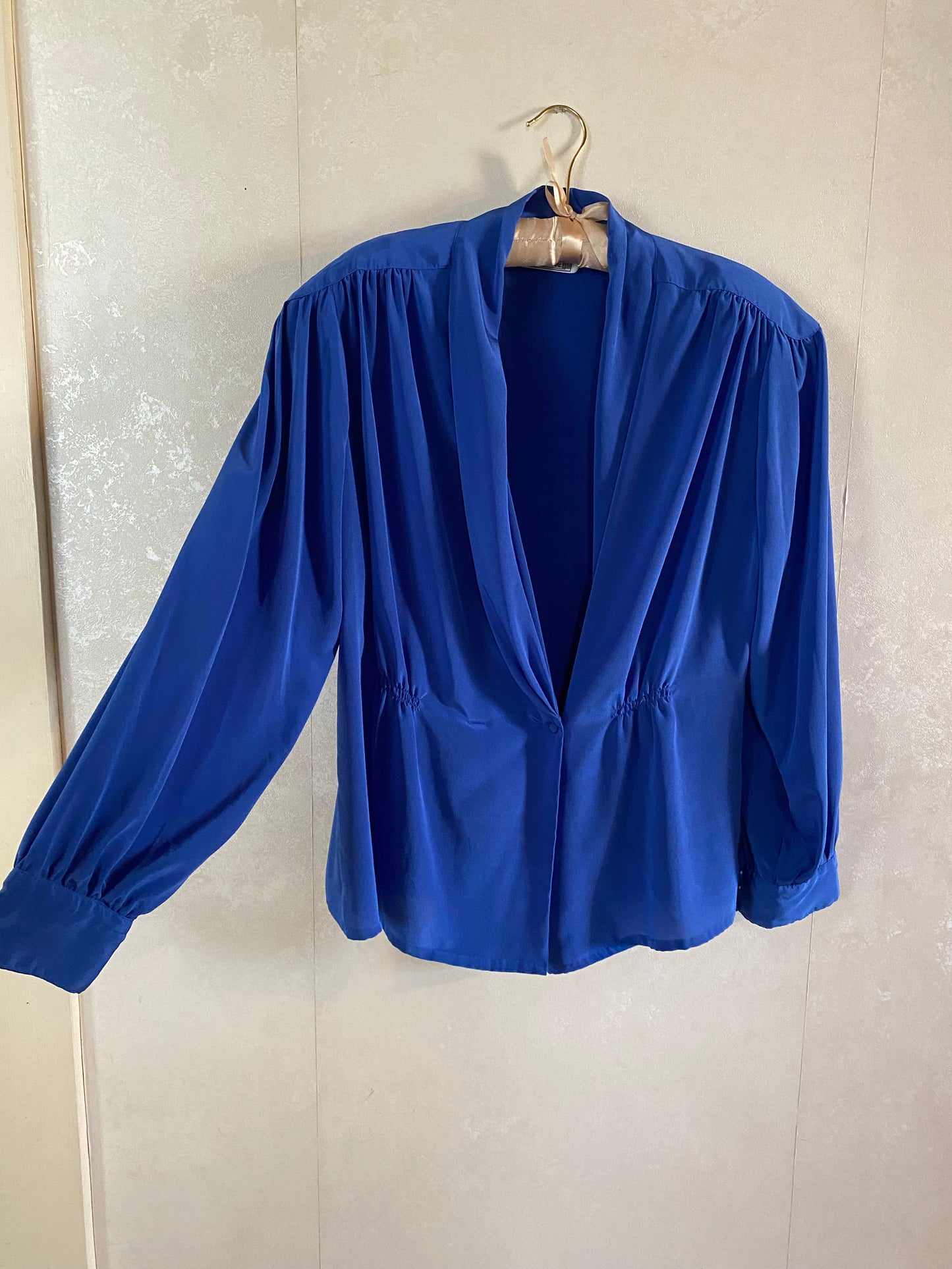 Draped Neckline with cinched waistline long sleeve blouse