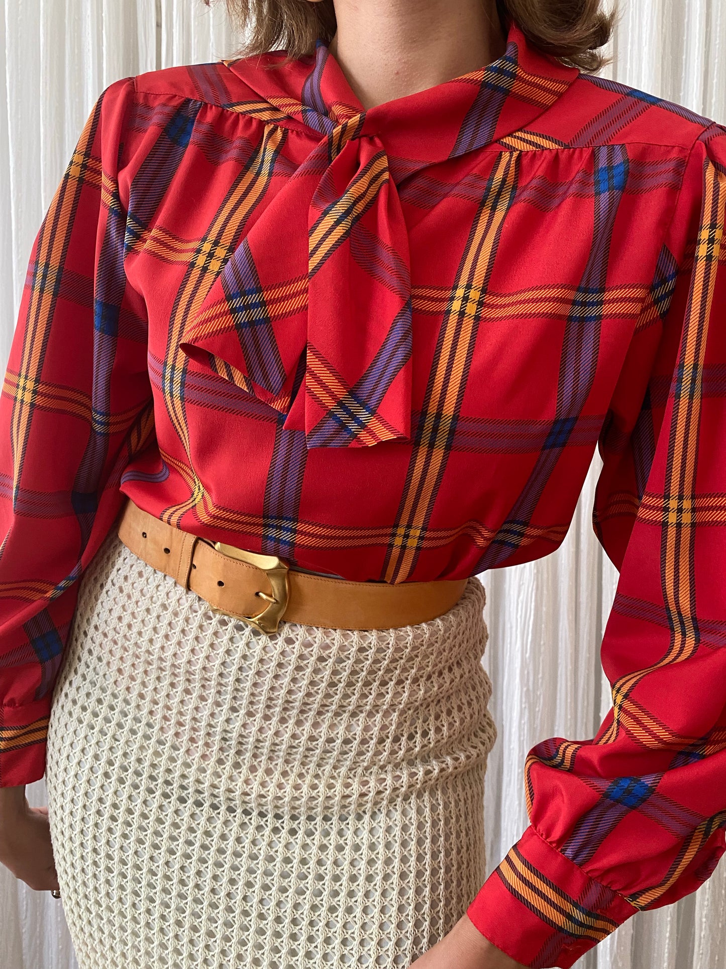 Plaid long sleeve top with small pussy bow tie neck